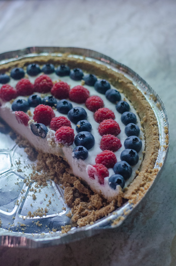 This 4th of July coconut cream pie is the epitome of a delicious summer dessert! It is light, creamy and full of fresh berries. Gluten-free, vegan, dairy-free.