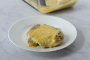 These delicious queso-smothered chicken thighs are SO simple to make. All you need is my three-ingredient queso dip recipe, some chicken thighs and an oven! Gluten-free, grain-free, low-carb, ketogenic. 
