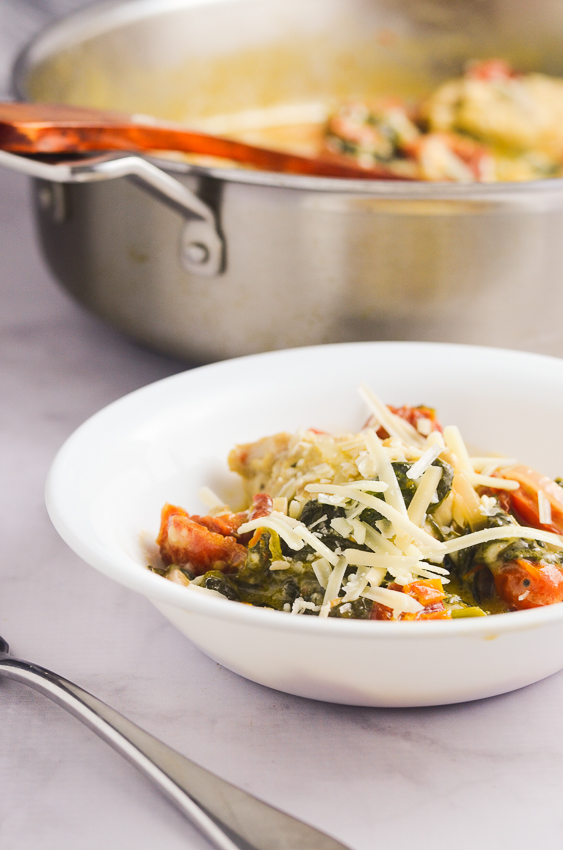 This super creamy Asiago chicken with spinach and tomatoes is so quick and easy, it can be made in one skillet in under a half an hour! Keto, low-carb, gluten-free, grain-free.