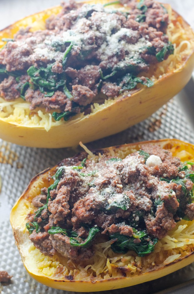 This spaghetti squash with meat sauce is a healthy alternative to a carb-filled dinner. Low-carb, paleo, whole30, gluten-free, grain-free, dairy-free.